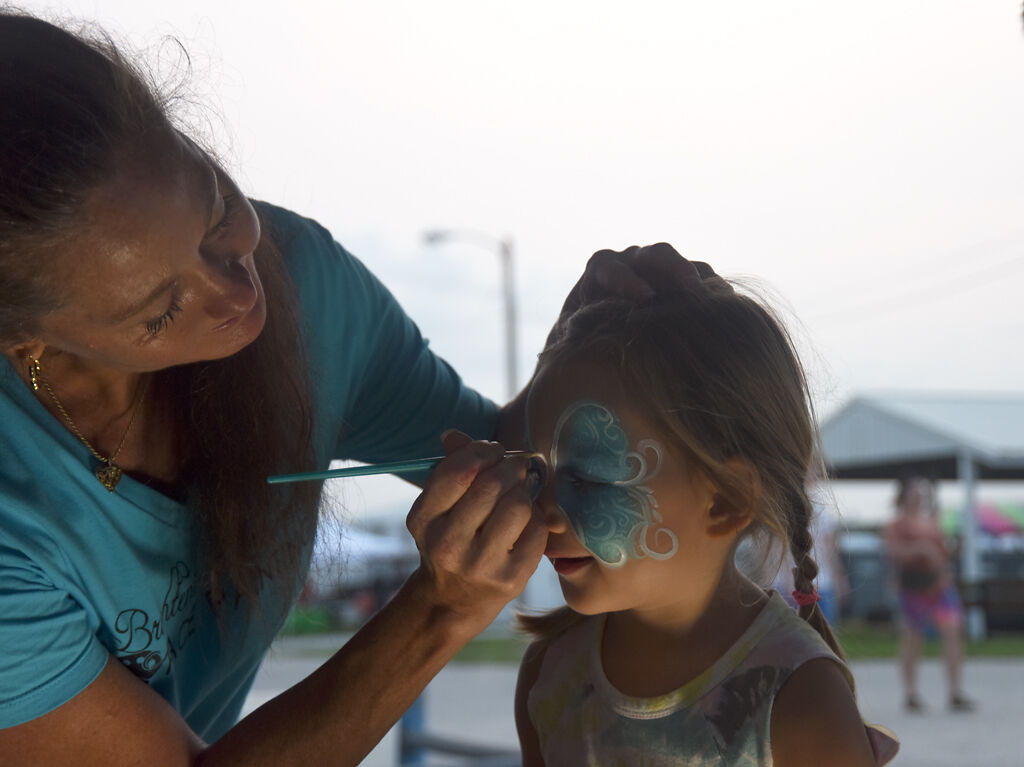 Monroe Mulzigan gets a butterfly face painting